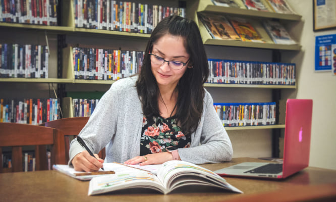 A person studying at a table